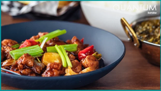 Stir-fried chicken with peppers and onions in a brown sauce